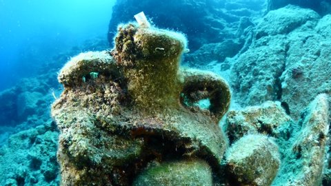 old amphora parts underwater historic ancient times under ocean