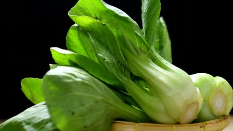bok choy vegetable in a basket rotated on table in 4k resolution