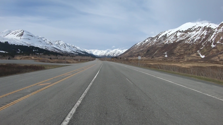POV at 2x; Driving Through the Granite Creek Valley in the Kenai Pennisula in Alaska on Seward Highway with Chugach Mountains in Background