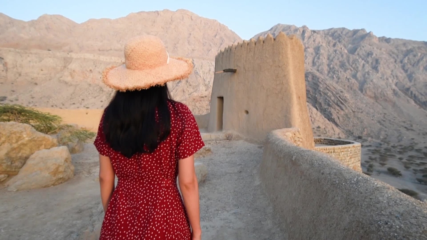 Woman visiting Dhayah Fort Ras Al Khaimah emirate of United Arab Emirates