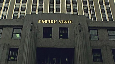 New York, United States America - 1981: old Empire State Building entrance facade in Manhattan from street view. Archival USA in 80s.