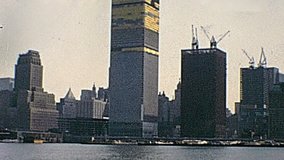 New York vintage footage on 1970 about lower Manhattan construction site of World Trade Center and Twin Towers under construction on seventy. New York skyline from New Jersey side.