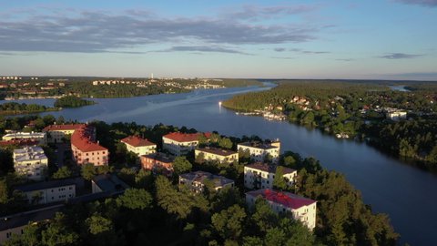 Aerial footage of the Stockholm island Stora Essingen and its western shore in morning light