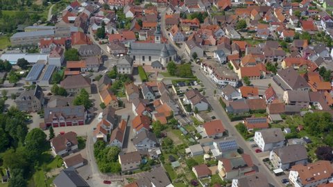 Aerial of the village Ubstadt in Germany. Pan to the left across downtown.
