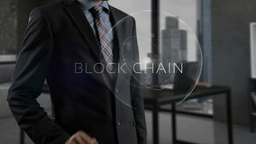 Block chain concept. Successful businessperson in formal wear blazer standing in modern office workspace. Skilled male holding smart phone in hands and creating holographic projection - Powered by Shutterstock - Get 15% off with code: PIKWIZARD15
