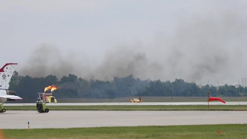FORT WAYNE, INDIANA / USA - June 8, 2019: The Shockwave Jet Truck spews fire and smoke while performing at the 2019 Fort Wayne Airshow.