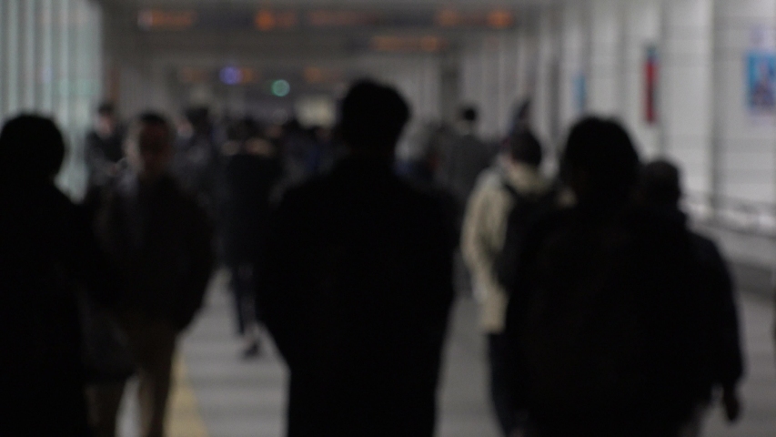 TOKYO, JAPAN - CIRCA APRIL 2019 : Scenery of RUSH HOUR at SHINJUKU.  Back shot of unidentified crowd of people going back to home from work at night. Defocus shot. | Shutterstock HD Video #1032639929