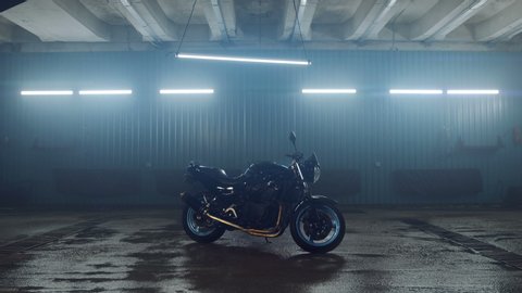 Street sports bike stands in a modern, stylish garage. Included neon lights. Motorcycle advertising. Motorcycle repair services. Need for Speed.