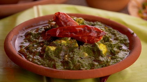 Palak paneer is a famous Indian dish served with different kinds of Indian breads.