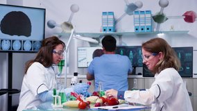 Genetically engineered food laboratory. Scientist are expeimenting with different fruits and vegetables - Powered by Shutterstock - Get 15% off with code: PIKWIZARD15