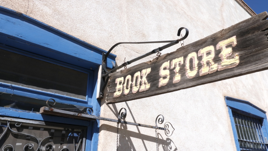 Old Book Store Entrance Move Down. view moves down from an old wooden book store sign to reveal entrance