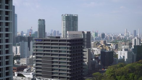 Tokyo downtown city view with green park and many skyscrapers, Japan
