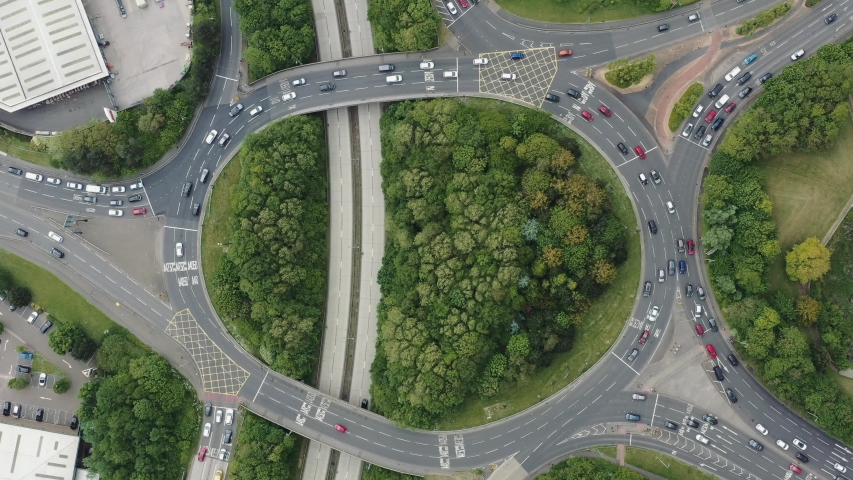 Ascending topdown aerial shot of Culverhouse Cross roundabout junction in Vale of Glamorgan Cardiff South Wales Royalty-Free Stock Footage #1032710753