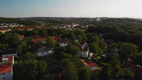 Amazing aerial footage over the suburban part of Gothenburg, Sweden called Karralund. Showing some beautiful houses with beautiful green gardens.