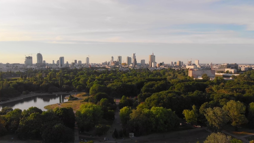 Pole Mokotowskie Warsaw Park field with lake and city aerial view at the sunset. Royalty-Free Stock Footage #1032755705