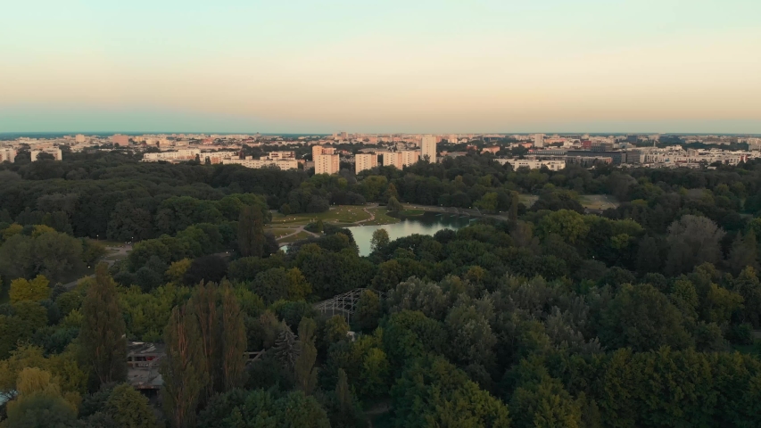 Pole Mokotowskie Warsaw Park field with lake and city aerial view at the sunset. Royalty-Free Stock Footage #1032755723