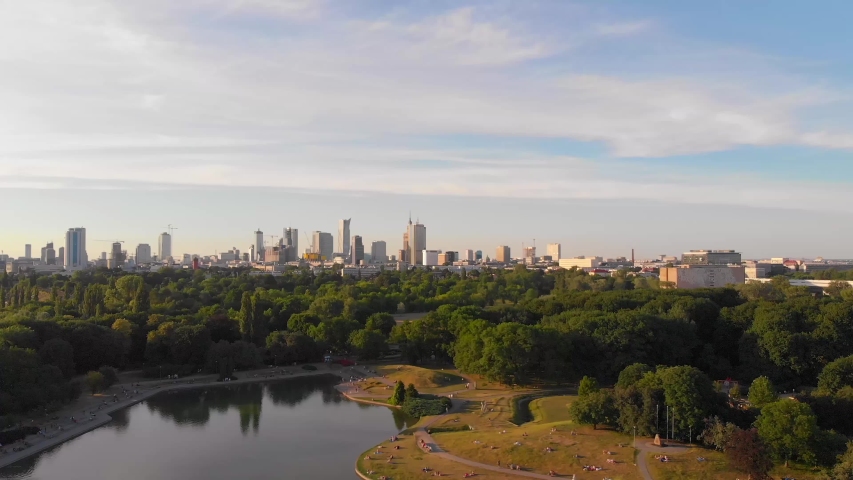 Pole Mokotowskie Warsaw Park field with lake and city aerial view at the sunset. Royalty-Free Stock Footage #1032755726