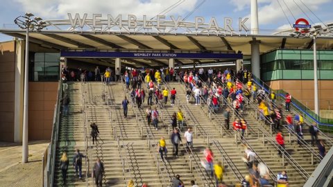London, England / United Kingdom - May 30 2015: Time lapse of people walking downstairs from Wembley Park Station to Wembley Stadium
