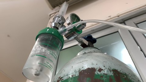 Closeup of oxygen humidifier bottle. Oxygen tank.