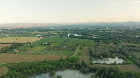 4K Aerial : Slow cinematic revealing shot of a rural landscape