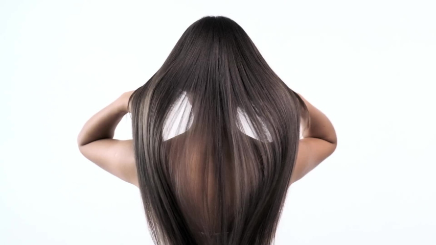 Woman moves long hair. Rear view. Girl shakes long straight hair. Female model is fluttering hair.   Slow motion footage. Rear view. | Shutterstock HD Video #1032804770