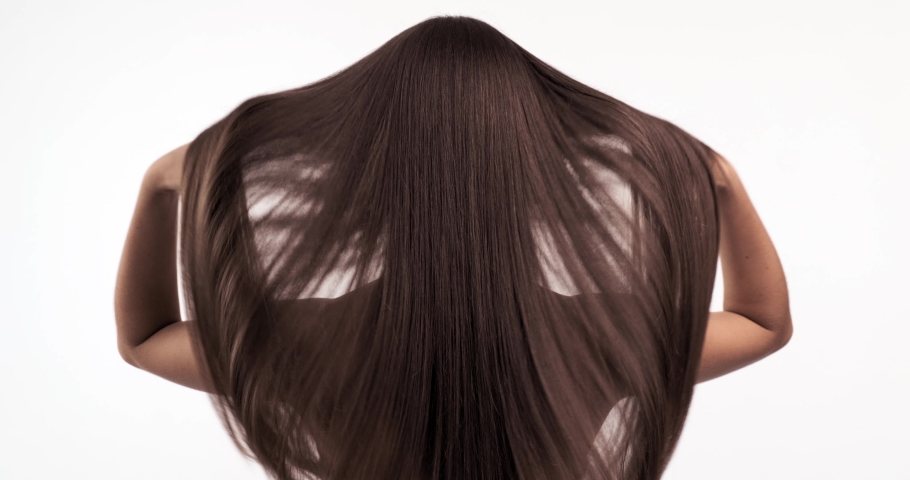 Woman moves long hair. Rear view. Girl shakes long straight hair. Slow motion footage. Rear view. 4k. Female model is fluttering hair. Ginger. Red haired.  | Shutterstock HD Video #1032804779