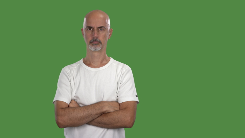 4K green screen footage, portrait shot man looking doubtful at camera, with mask looping
