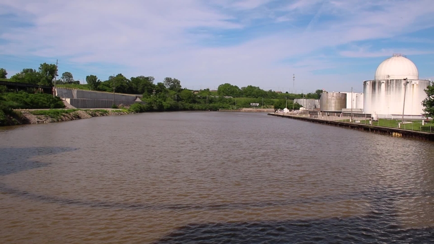 The Cuyahoga River with a chemical plant on the shoreline in Cleveland Ohio