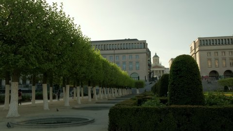 BRUSSELS/BELGIUM - 24TH APRIL 2019: Pan across the garden of Mont Des Arts in Brussels to the Royal Library of Belgium