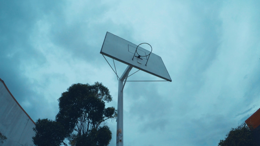 Basketball Hoop with Dark Sky Background