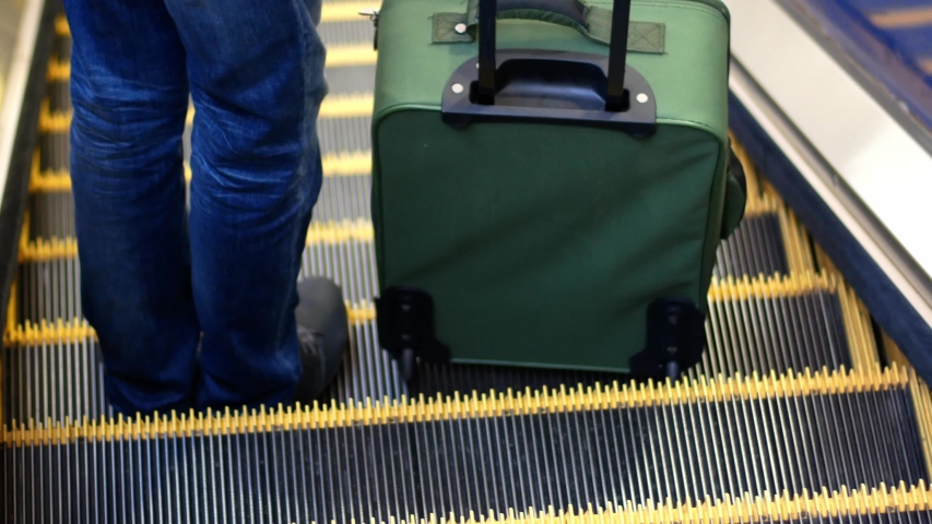 wrapping suitcases in cling film