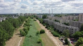 
Aerial view of the dwelling houses and skyscrapers of the city of Warsaw / Poland. City landscape, Wilanow district, busy streets and parks on a sunny summer day. Shot on Drone 4K