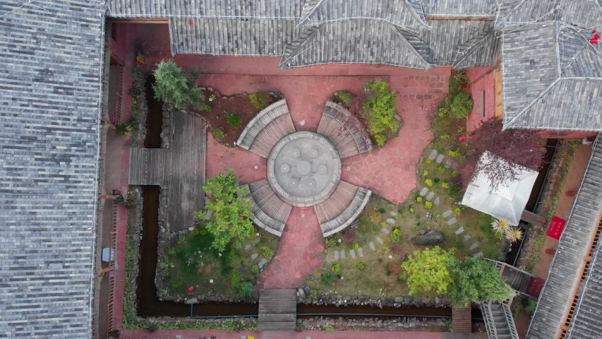 Aerial drone shot of the  traditional Chinese yard house with trees and plants. Asia, China. Old building. 