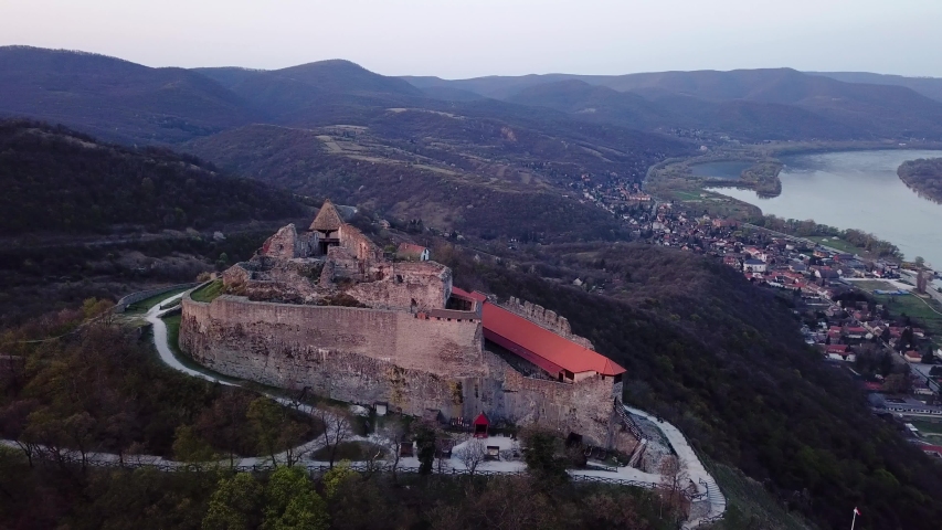 Aerial orbit landcape shot of castle visegrad river danube and village background hungary europe