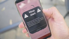 Receiving a VIRUS warning notification on a smartphone screen. Blinking alert concept. - Powered by Shutterstock - Get 15% off with code: PIKWIZARD15