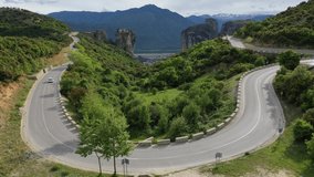Cyclist on a beautiful paved mountain road in Greece	