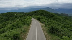 Cyclist on a beautiful paved mountain road in Greece	