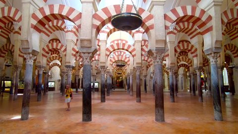 Cordoba, Spain - July 7, 2019 :  The Great Mosque or Mezquita, Mesmerizing arches inside the Great Mosque of Cordoba or Cathedral - Mosque of Cordoba in Cordoba, Spain