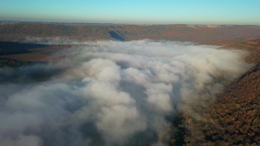 flight above the clouds above the river, Aerial view of Fog over the river at sunrise, thick fog over the river aerial, fog over the Dniester, river in the morning mist, Fog at sunrise