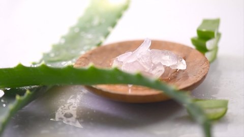 Aloe Vera gel closeup. Sliced Aloevera and gel, natural organic renewal cosmetics, alternative medicine. Skin care concept. Rotation On white background. 4K UHD video. Slow motion