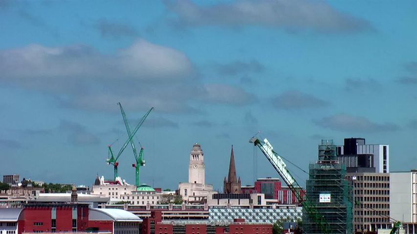Time Lapse of Leeds City Centre Skyline including Parkinson Building, Leeds Town Hall & Cranes during Summer’s Day with Blue Sky & White Clouds