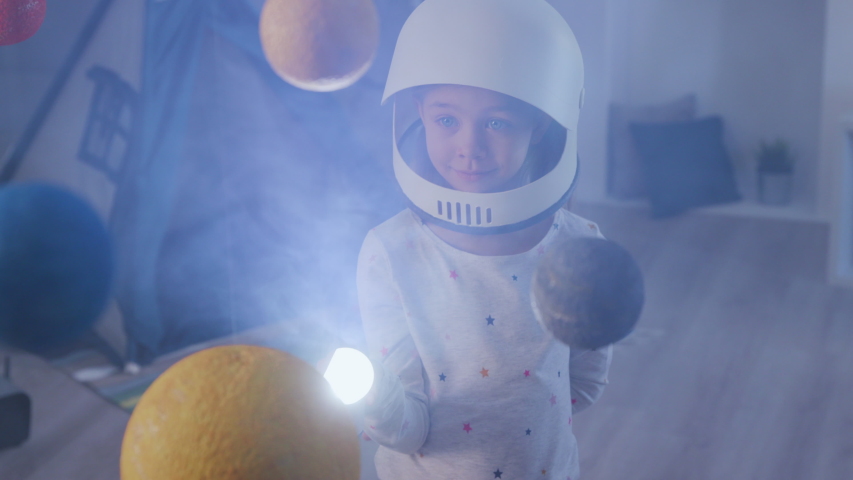 Flying Mission out Earth Globe in Cosmonaut Costume at Sci Fi Playground. Nasa Search of Creative Playful Person. Flashlight of Beautiful Small Dreamer. Modern Baby Lifestyle in Night Joy Room Closeup Royalty-Free Stock Footage #1032903578