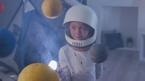 Flying Mission out Earth Globe in Cosmonaut Costume at Sci Fi Playground. Nasa Search of Creative Playful Person. Flashlight of Beautiful Small Dreamer. Modern Baby Lifestyle in Night Joy Room Closeup