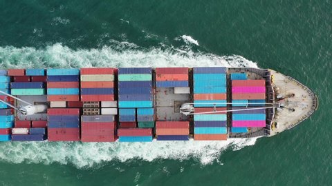 Aerial view on the top of the cargo ship carrying out export and import business Logistics and transportation