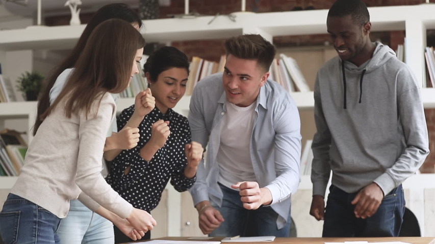 Happy united multiethnic college university students office business people stacking fists engaged in teambuilding motivated by success, team support help teamwork, international friendship concept Royalty-Free Stock Footage #1032911069