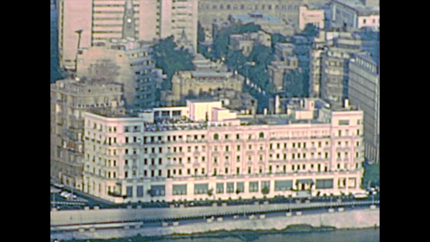 Aerial panorama of the Cairo streets and Qasr al-Nil Bridge. Ancient traffic with vintage cars. Archival from Cairo tower of Egypt in the 1970s.
