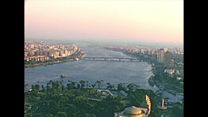 Aerial view panorama of the Cairo streets and Opera square and Qasr al-Nil Bridge. Cairo University Bridge and city traffic with vintage cars. Archival from Cairo tower of Egypt in the 1970s.