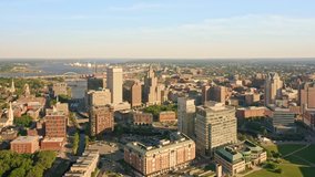 Drone footage of Providence, Rhode Island on a late sunny afternoon. The camera pans along the downtown skyline. Providence is the capital city of the U. S. state of Rhode Island.