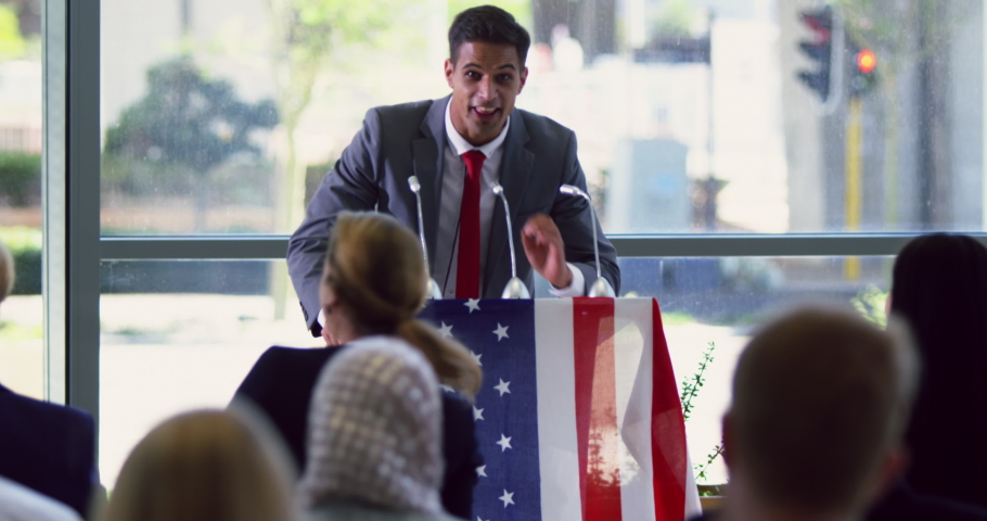 Front view of Caucasian male speaker speaks in a business seminar at modern office Business people are applauding and celebrating in a business seminar 4k