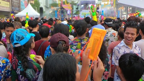 Bangkok, Thailand-April 14, 2019: Locals and tourists celebrate Songkran Festival, Traditional Thai New Year. People play water, and use water guns to enjoy the festival.